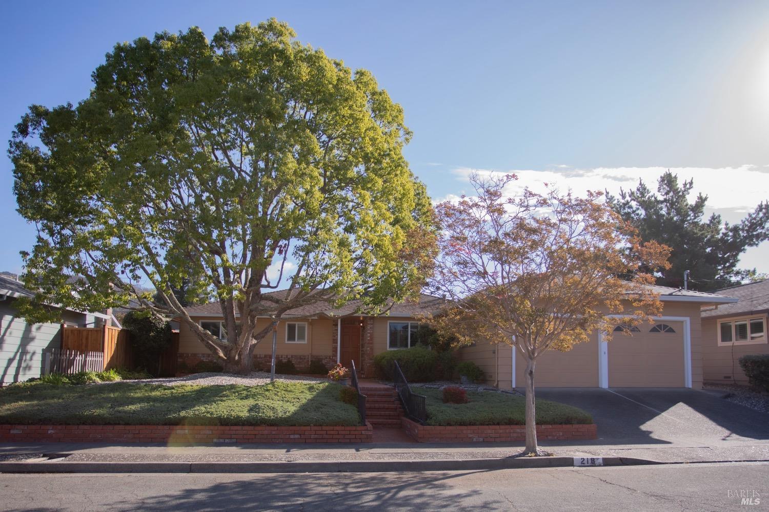 a front view of a house with garden