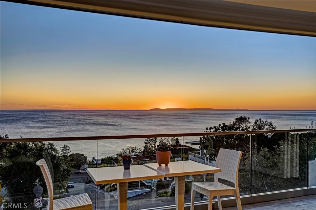 a view of a chairs and table in patio