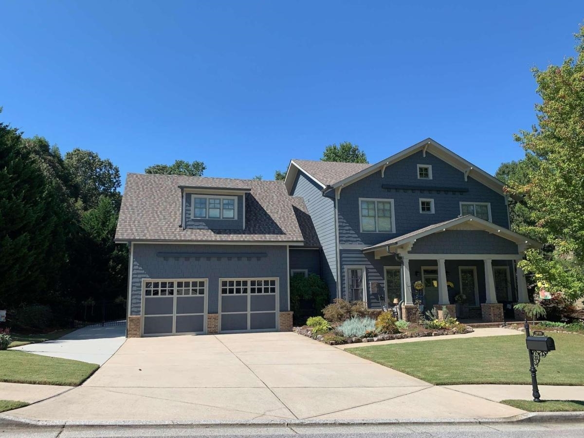 a front view of a house with a yard