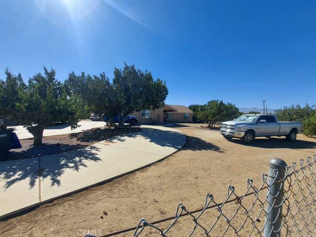 a view of a street with cars on the road