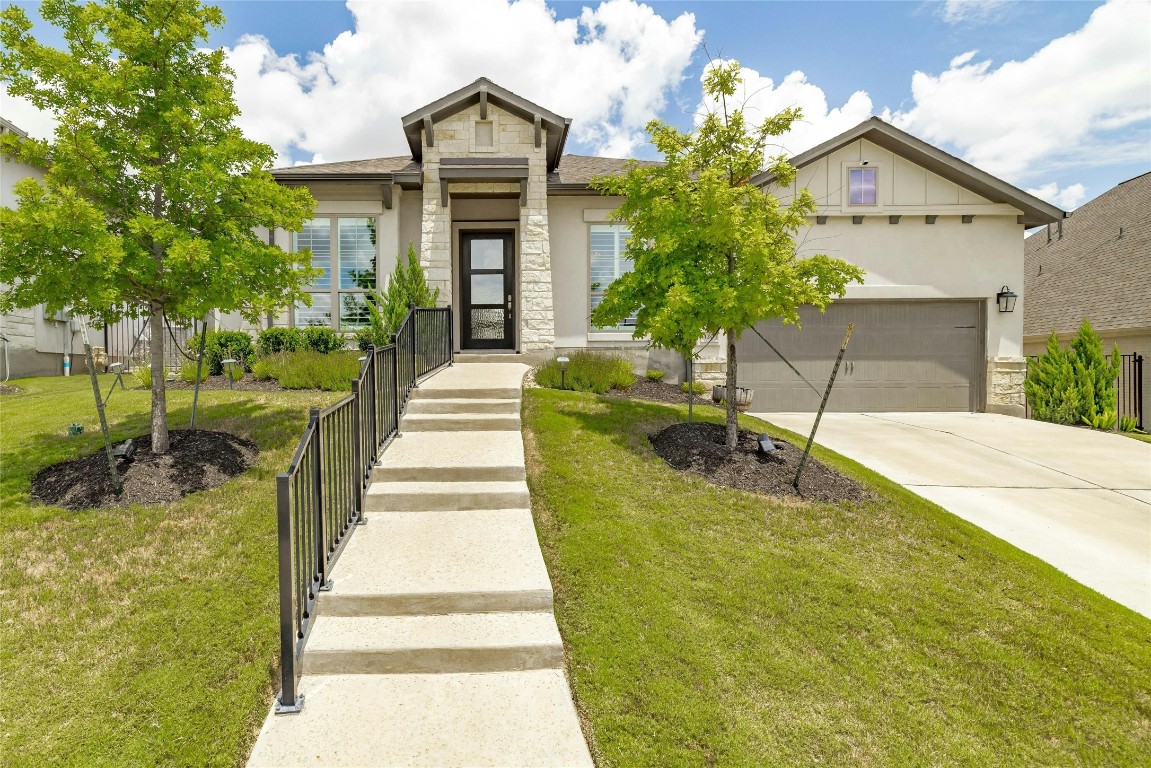 a front view of a house with a yard