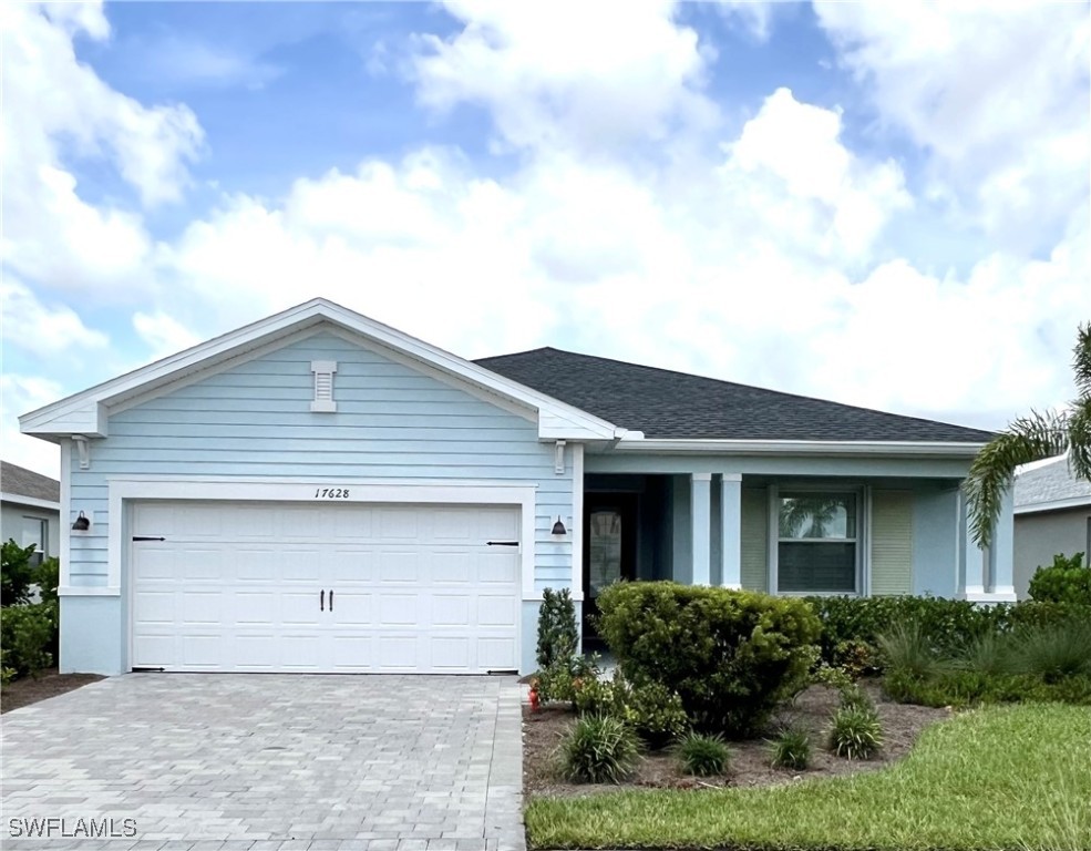 a front view of the house with garage