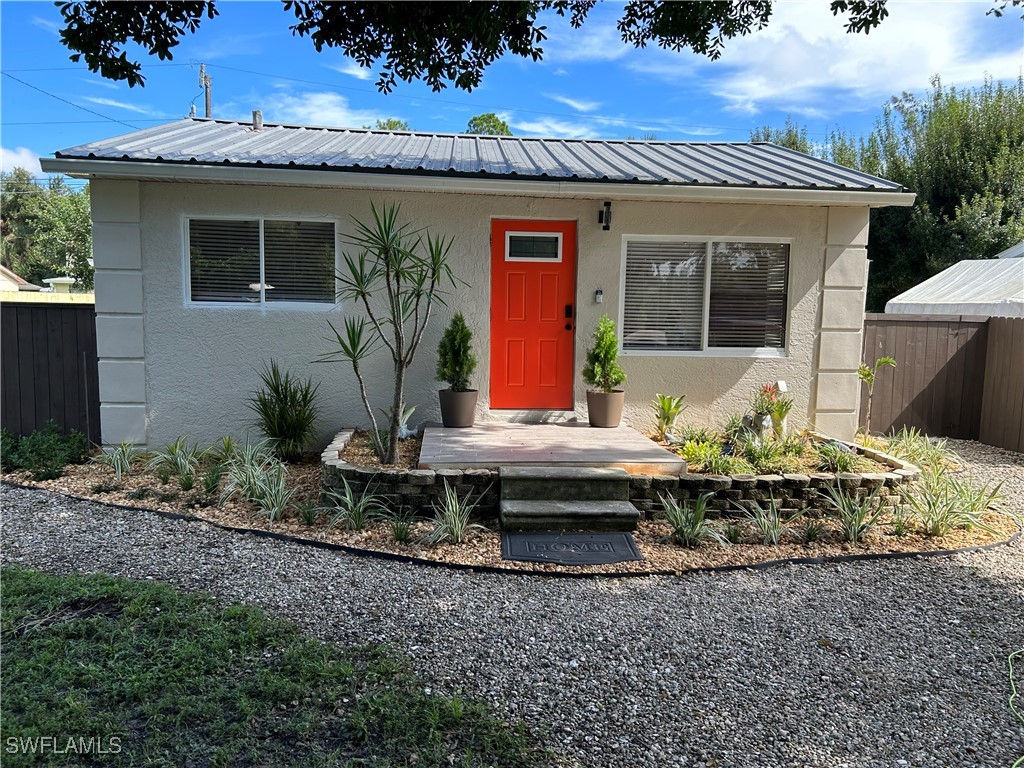 a front view of a house with sitting area