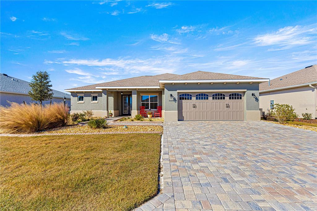 a view of house with outdoor space and swimming pool