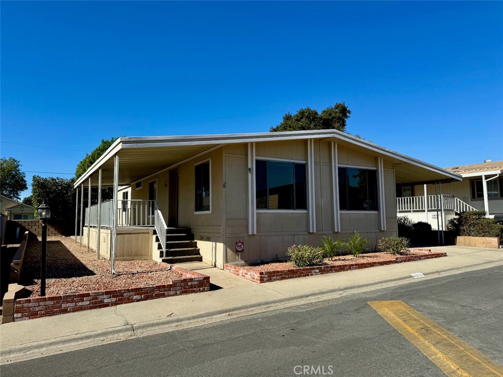 a front view of a house with a outdoor space