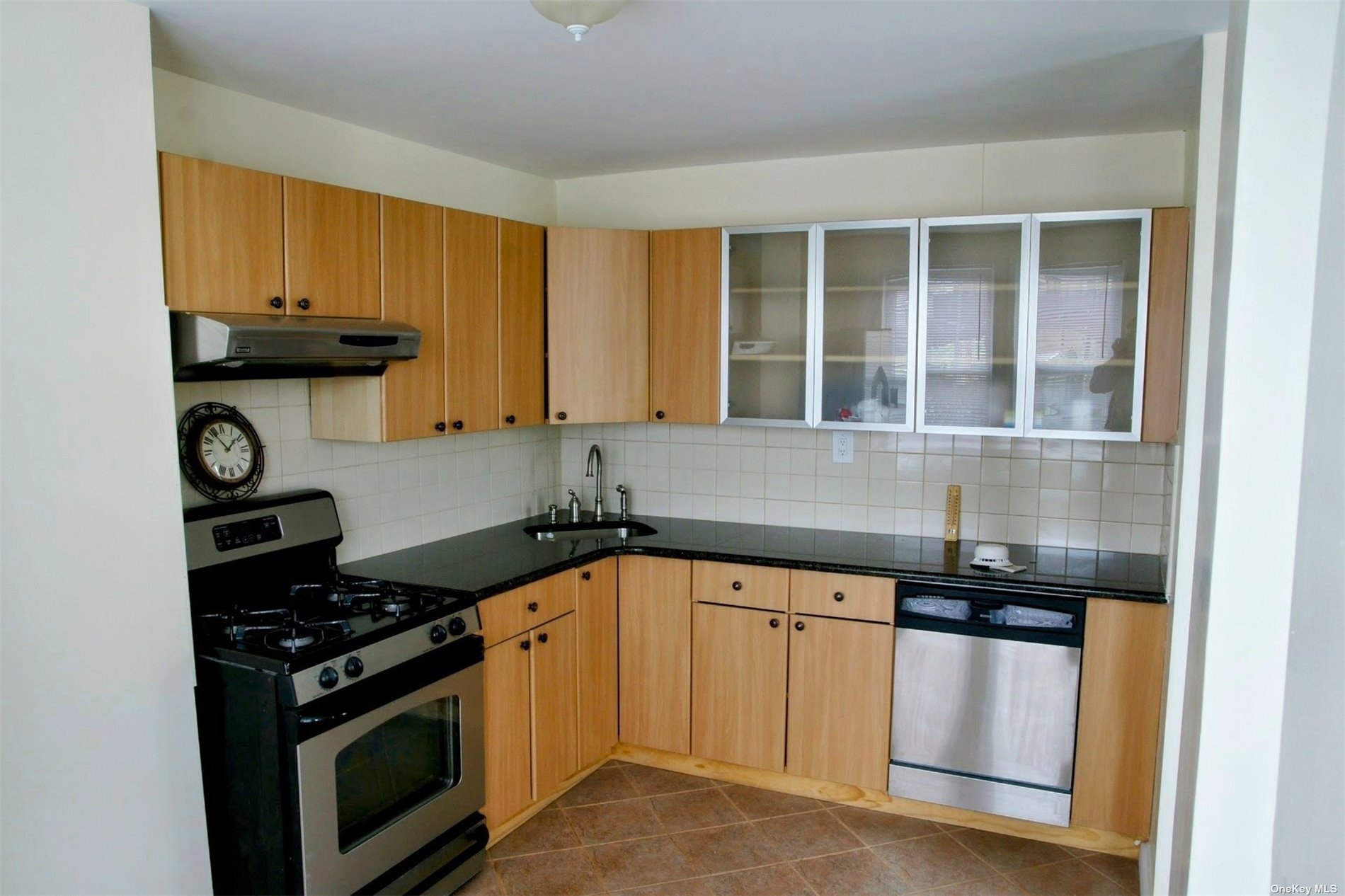 a kitchen with a stove and a sink