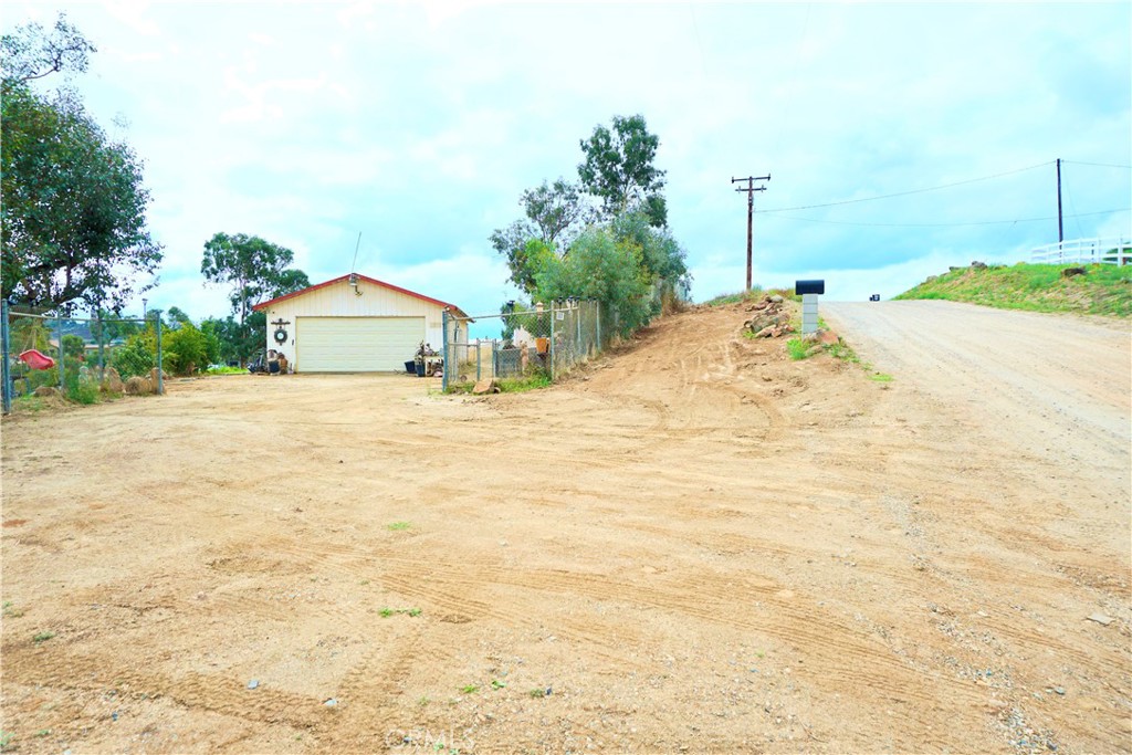 a view of a backyard of the house