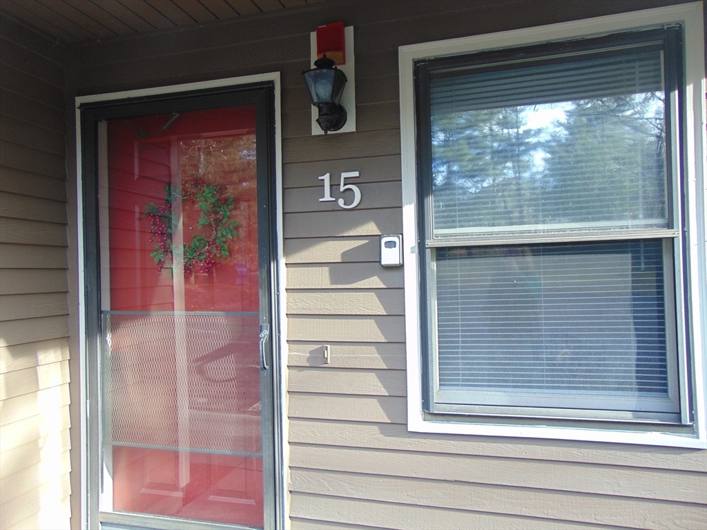 a view of a door and a window