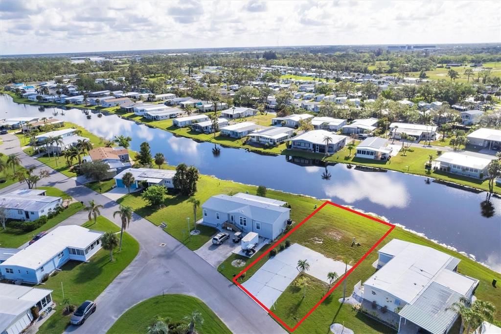 an aerial view of a houses with a swimming pool