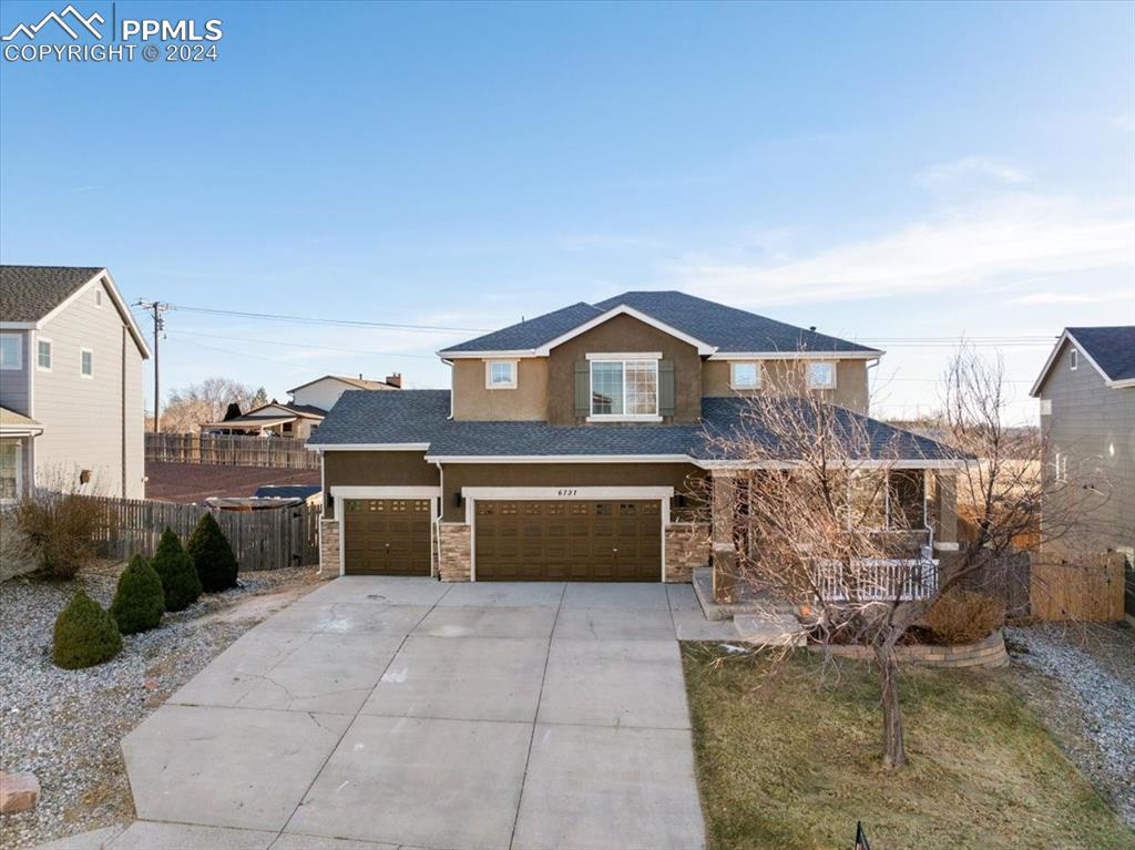 View of front of property with a garage