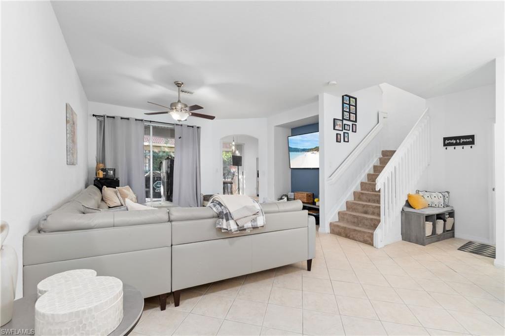 a living room with furniture and white walls