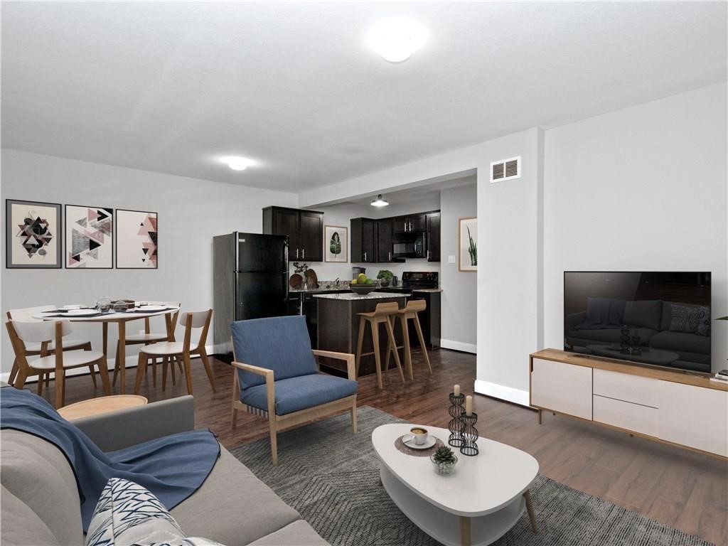 a living room with furniture and a flat screen tv