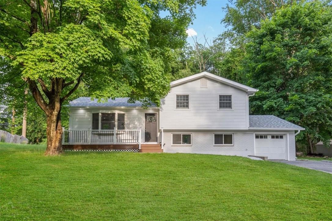 a view of a house with a backyard