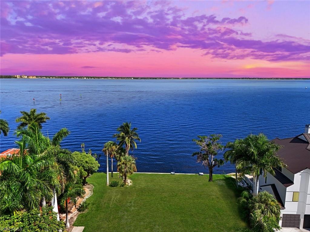 a view of a yard with an ocean