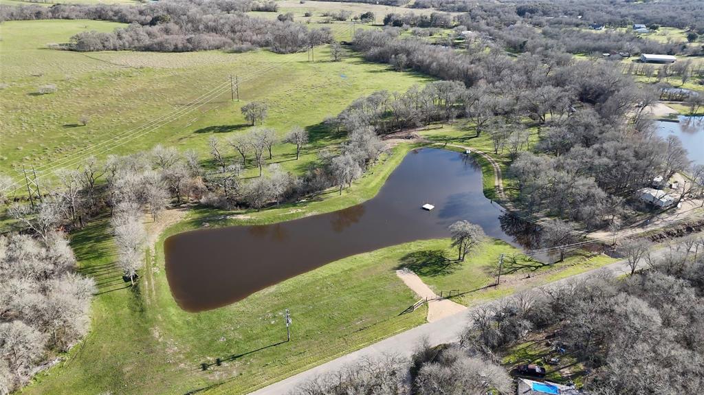 a view of a lake with a yard