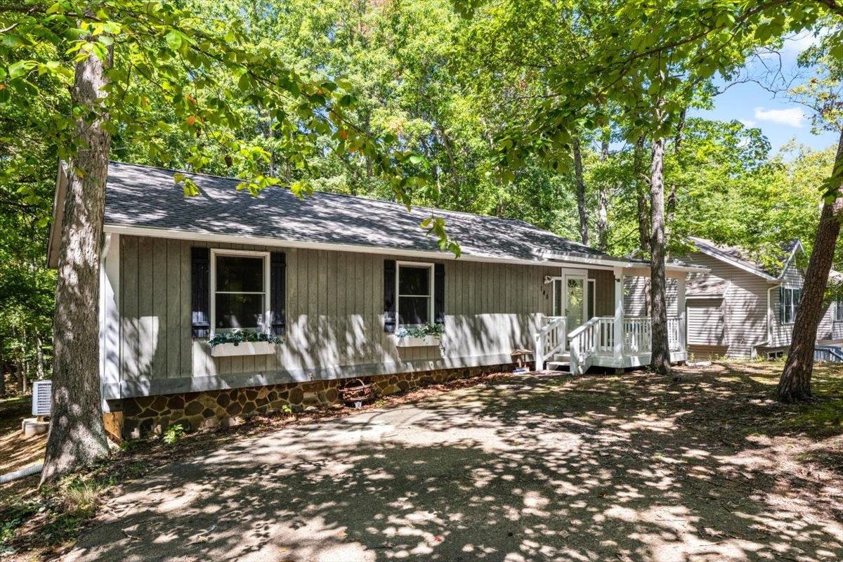 a front view of a house with yard outdoor seating