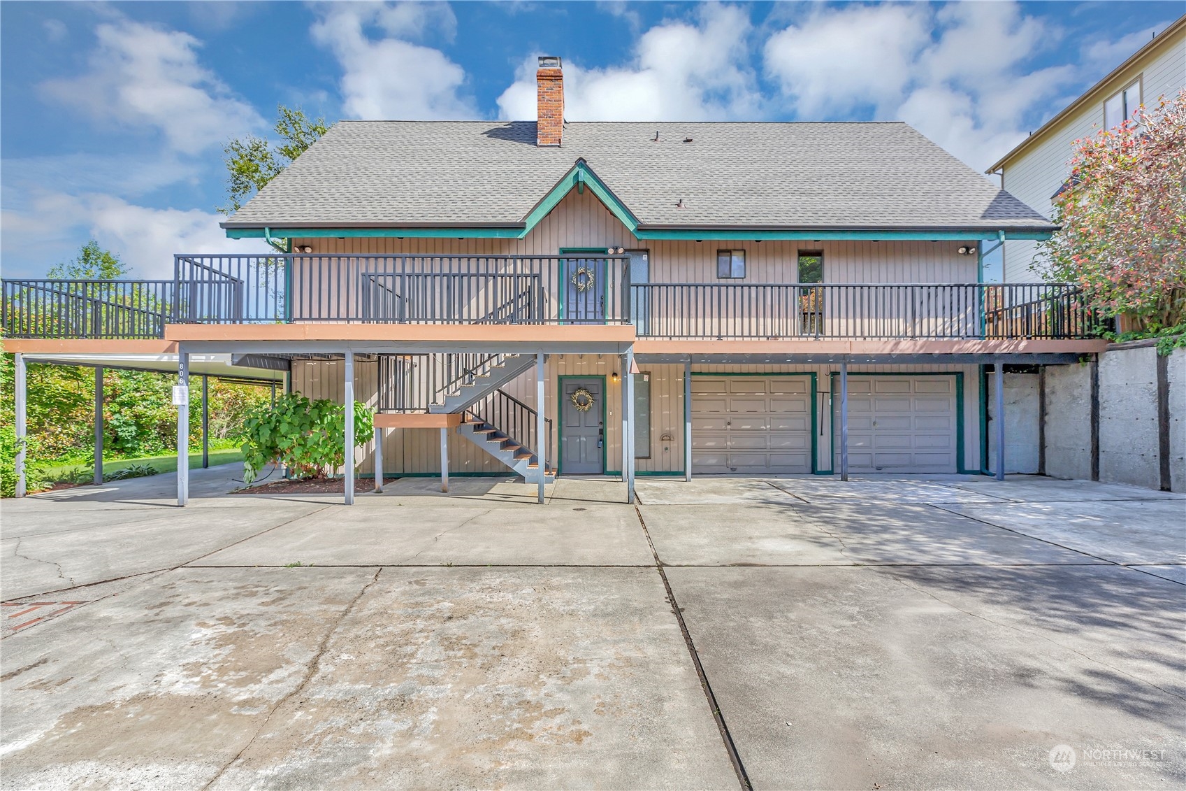 a view of house with outdoor space and balcony