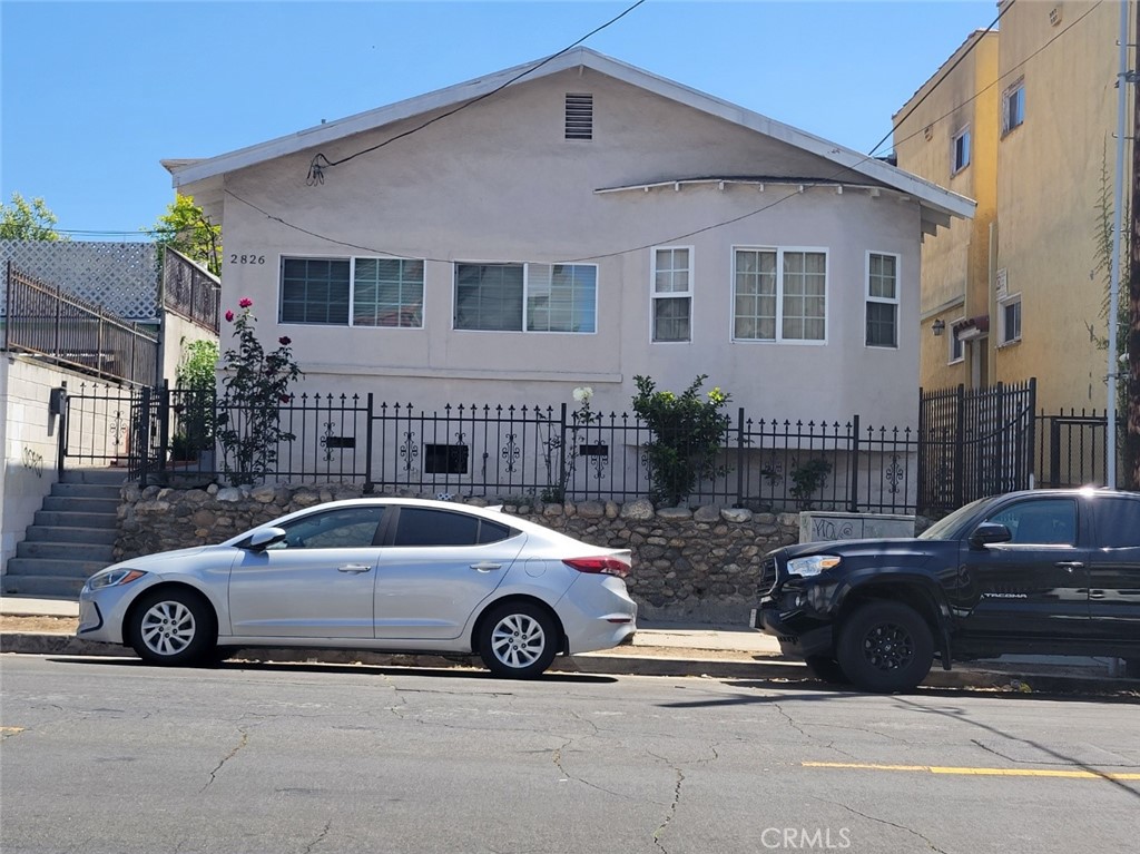 a view of a car parked in front of a house