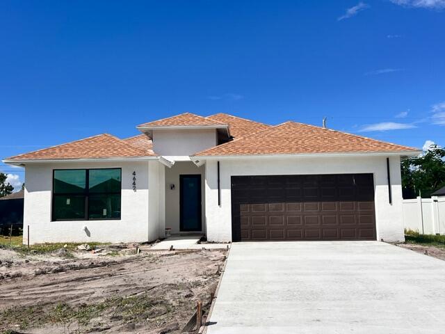 a front view of a house with a garage