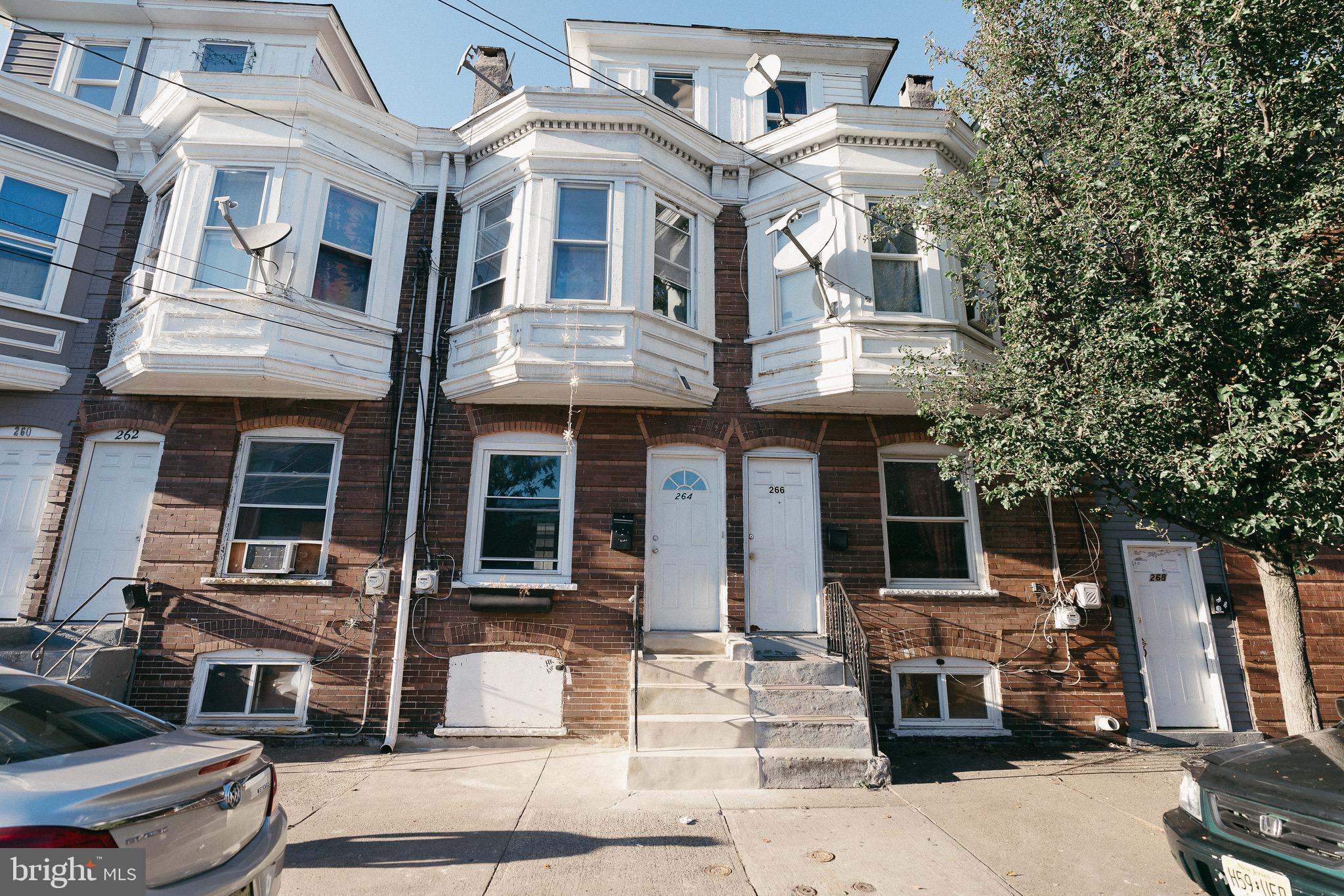 a front view of a house with a porch