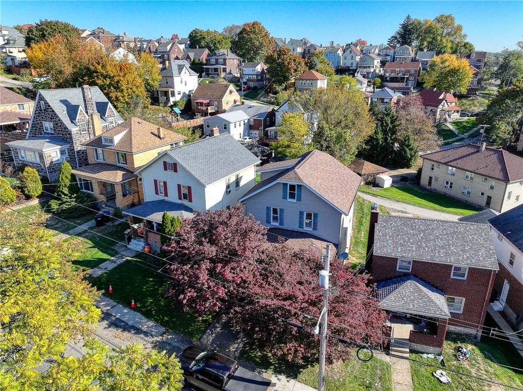 a aerial view of a house with a garden