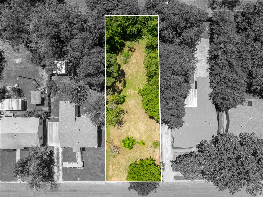 an aerial view of residential house with outdoor space