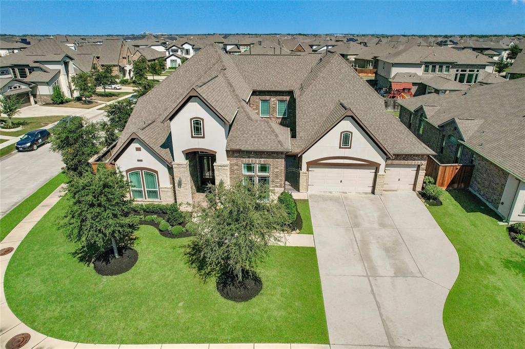 a aerial view of a house with a yard