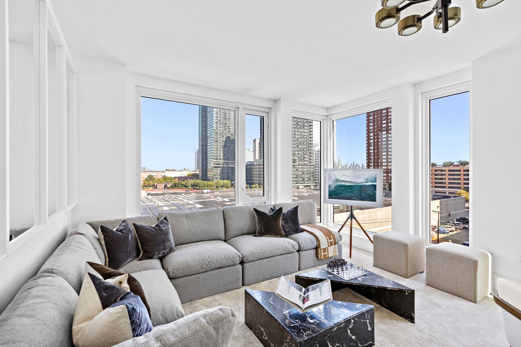 a living room with furniture and a large window