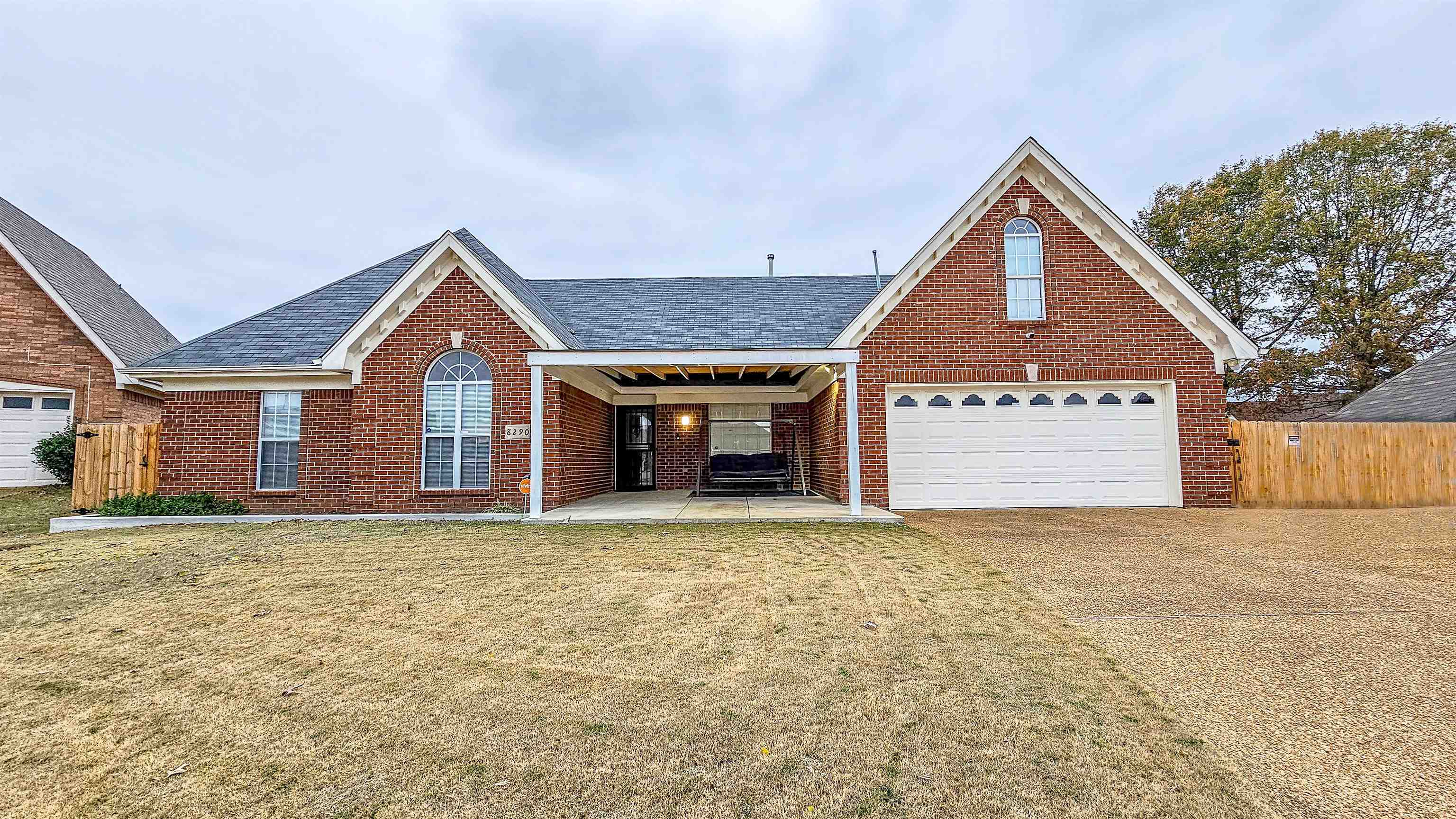 a view of a house with a yard and garage