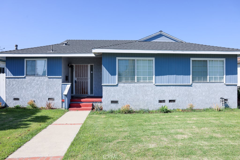 front view of a house with a yard