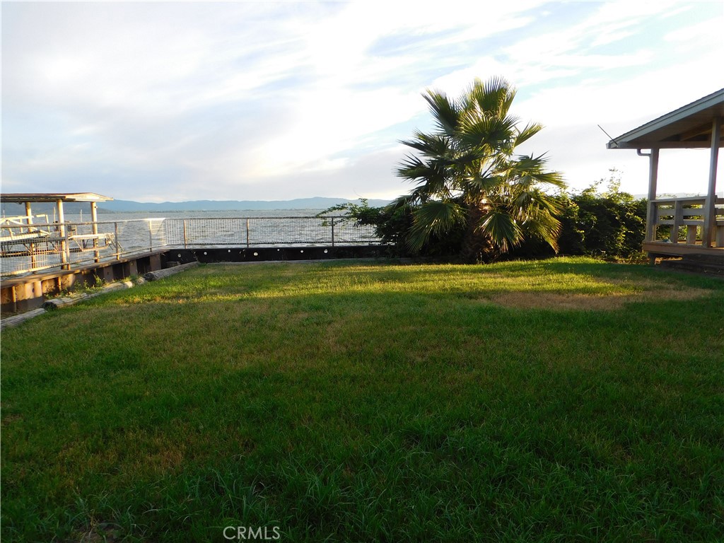 a view of a big yard with a house