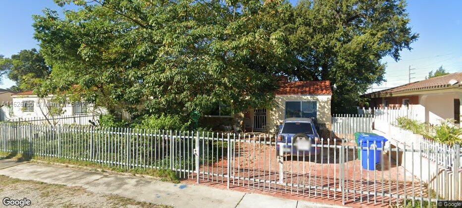 a view of a entrance gate of a house