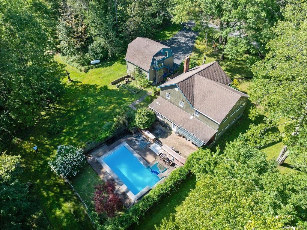 an aerial view of a house with a garden