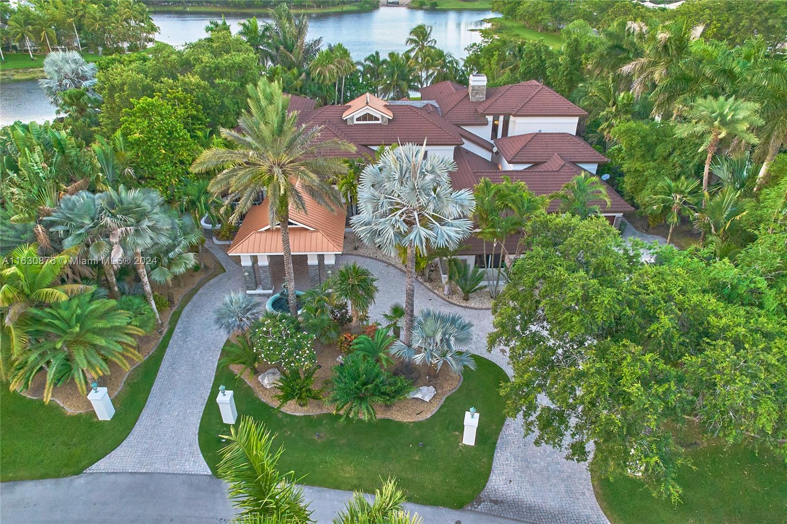 an aerial view of a house with garden space and street view