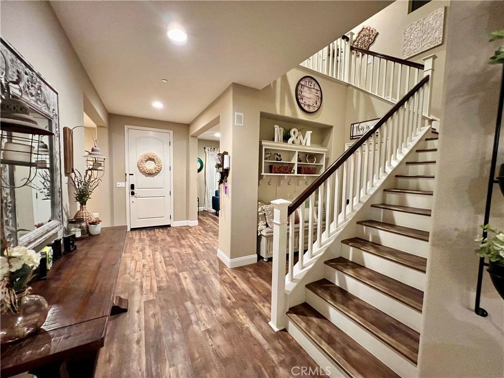 a view of entryway with wooden floor