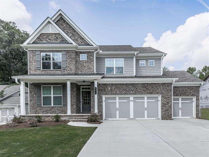 front view of a house with a yard