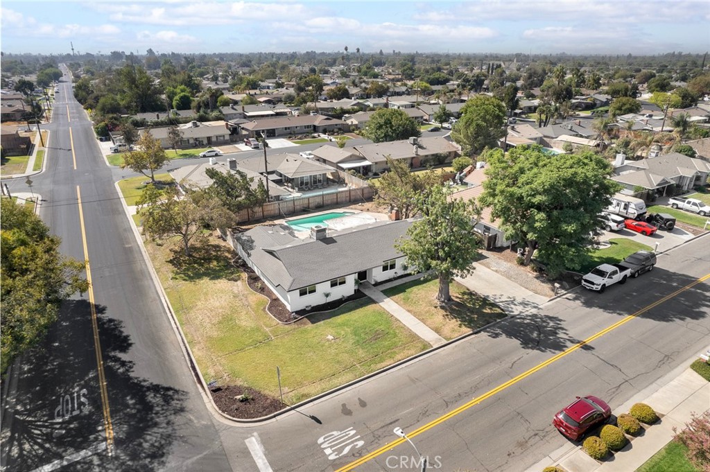 an aerial view of a house with a swimming pool