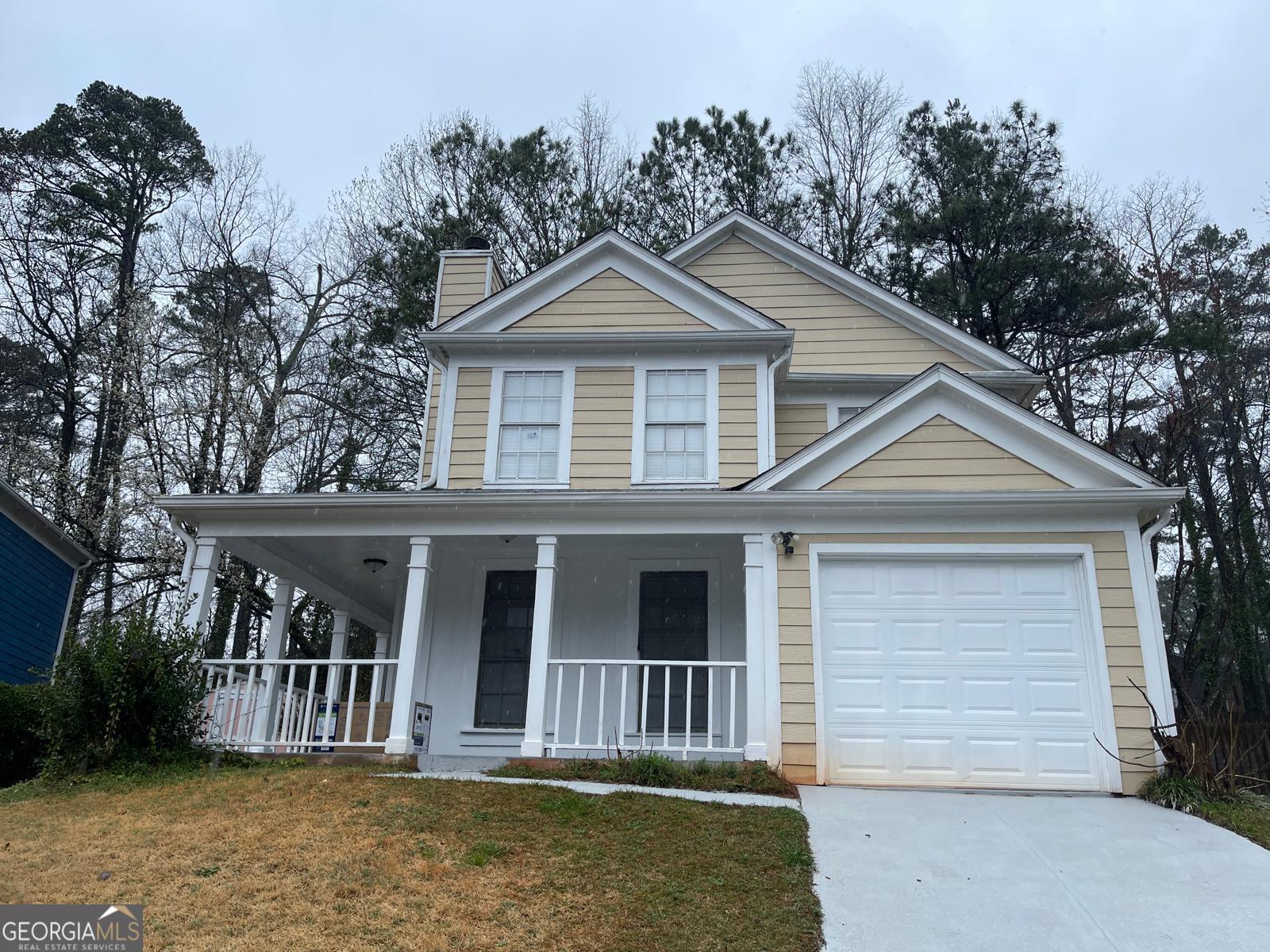 front view of a house with a yard