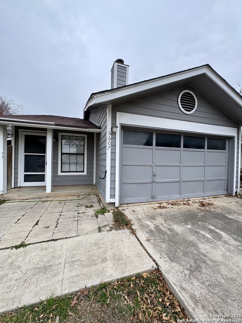 a front view of a house with a garage