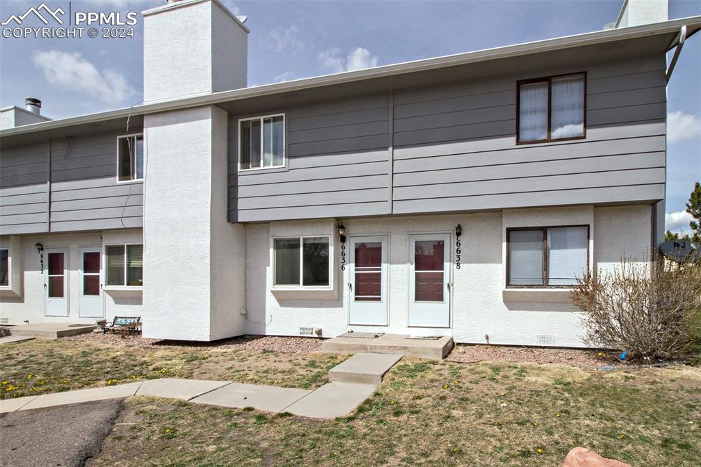 a house that has a window in front of it