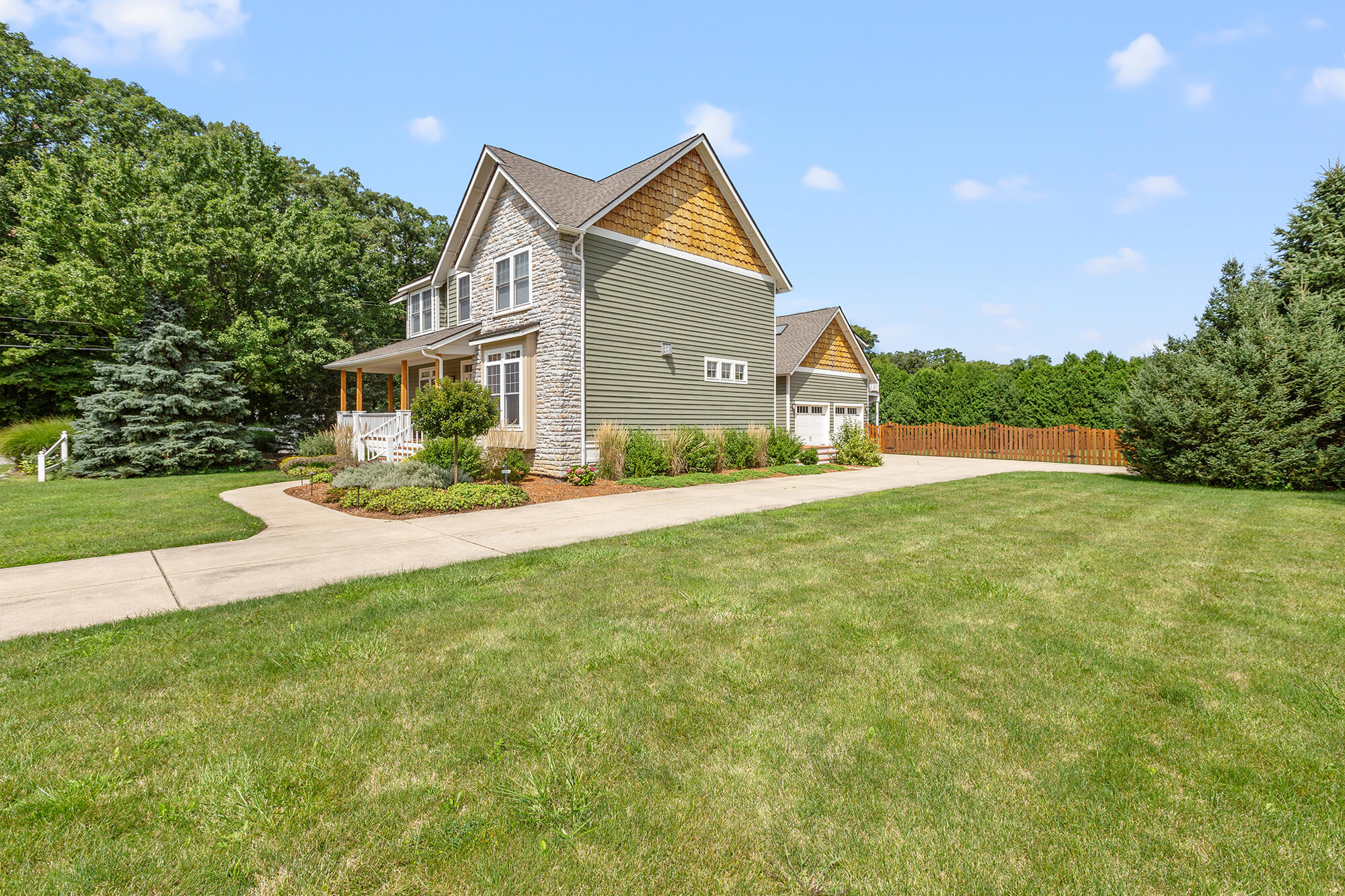 a front view of house with yard and green space