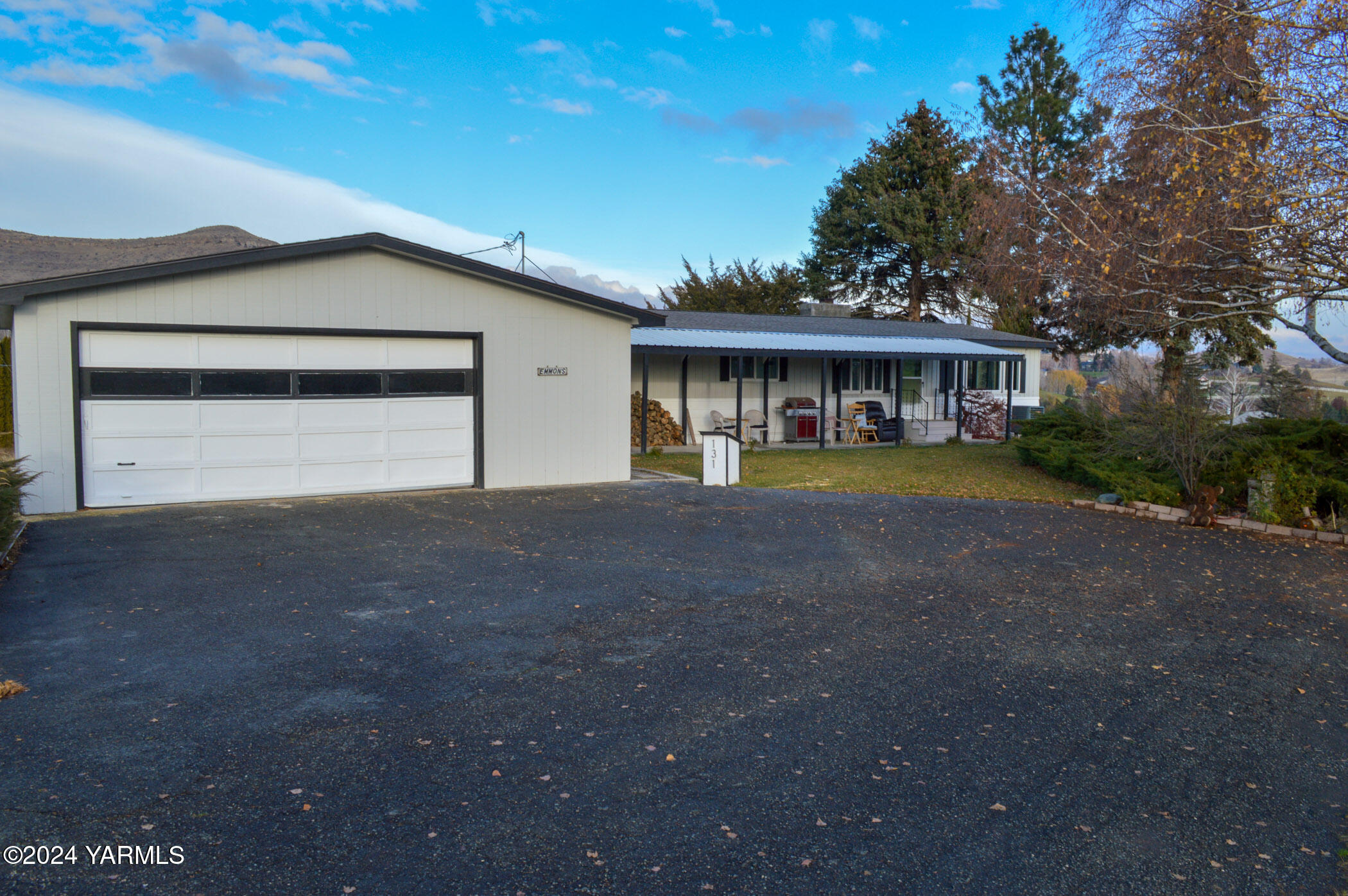 a view of a house with a outdoor space and a yard