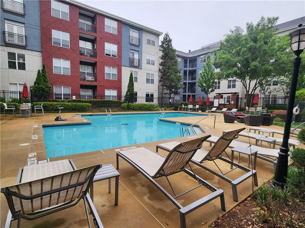 a view of a swimming pool with lounge chair