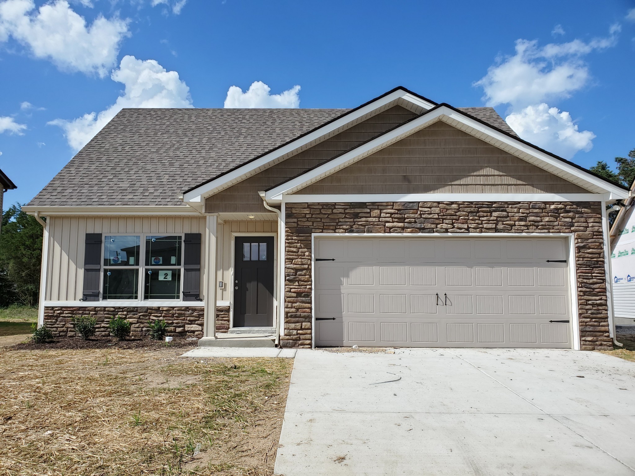 Welcome Home to Your Beautiful New Home in Valley Farms.  Upgraded Stacked Stone and Board & Batten Siding on the Front.   Picture of a Similar Previously Built Home.