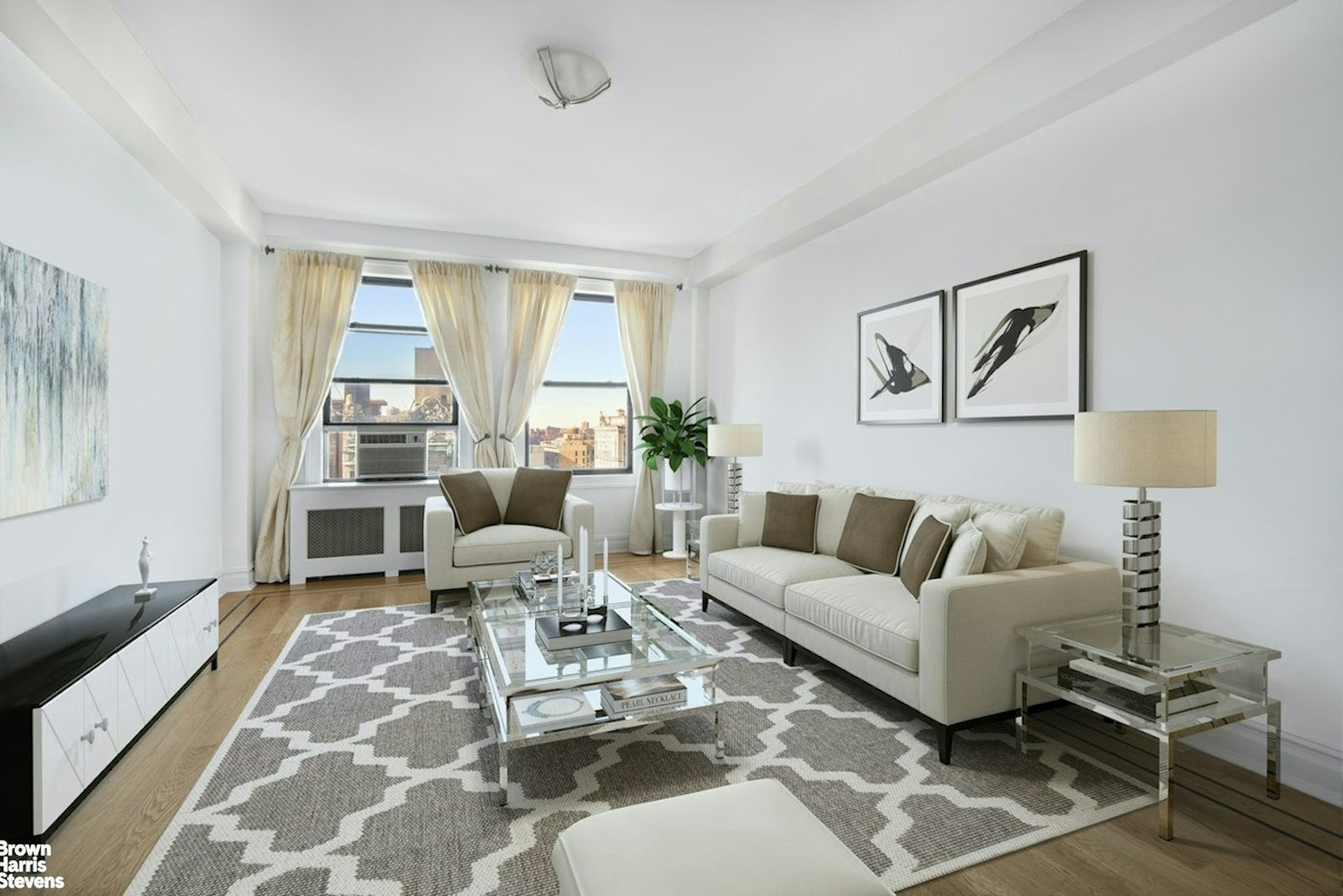 a living room with furniture large window and table