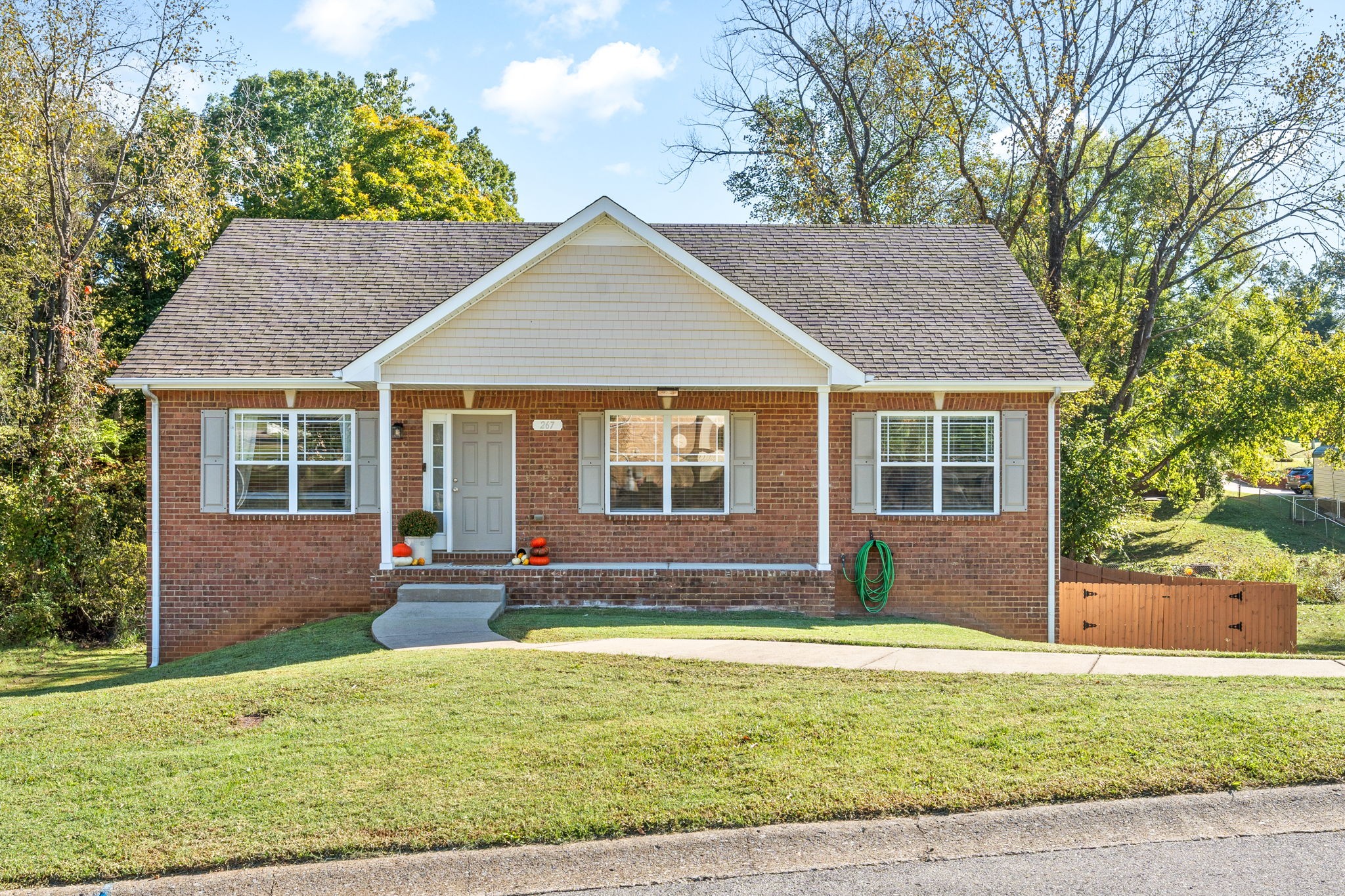 a front view of a house with a yard