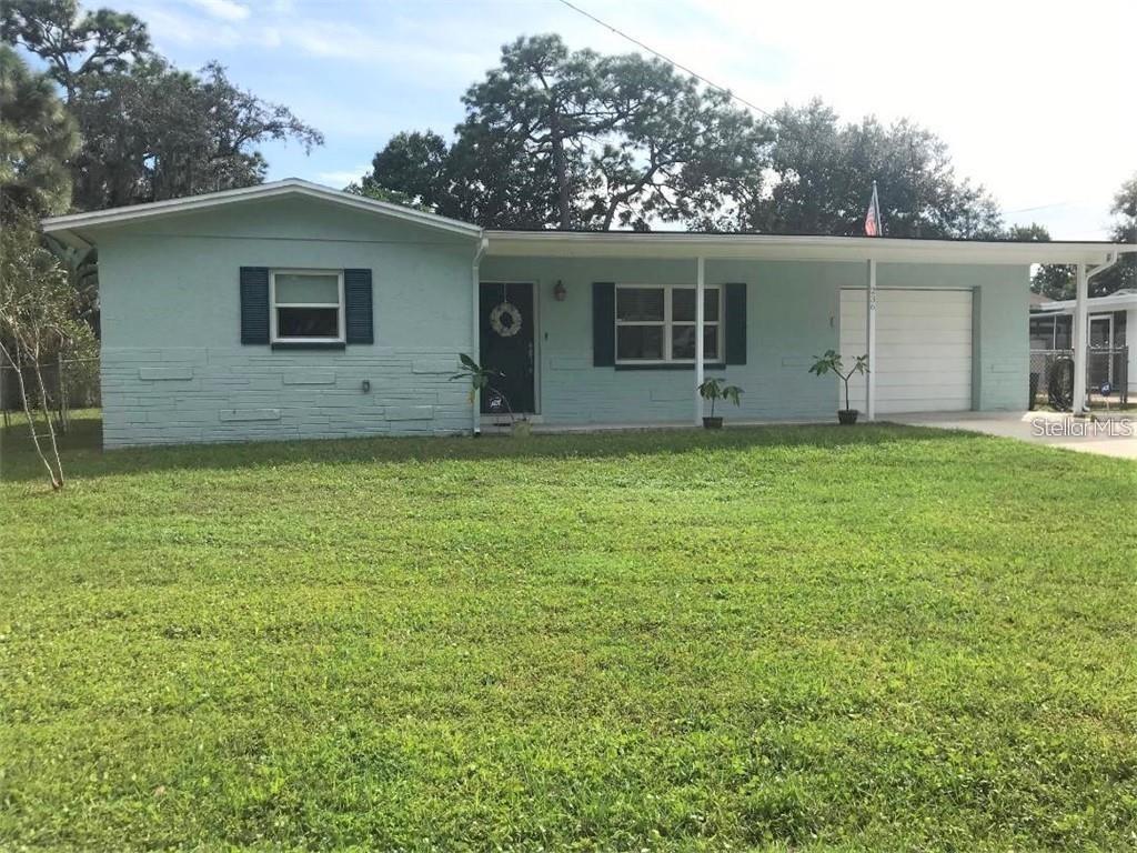 front view of a house and a yard