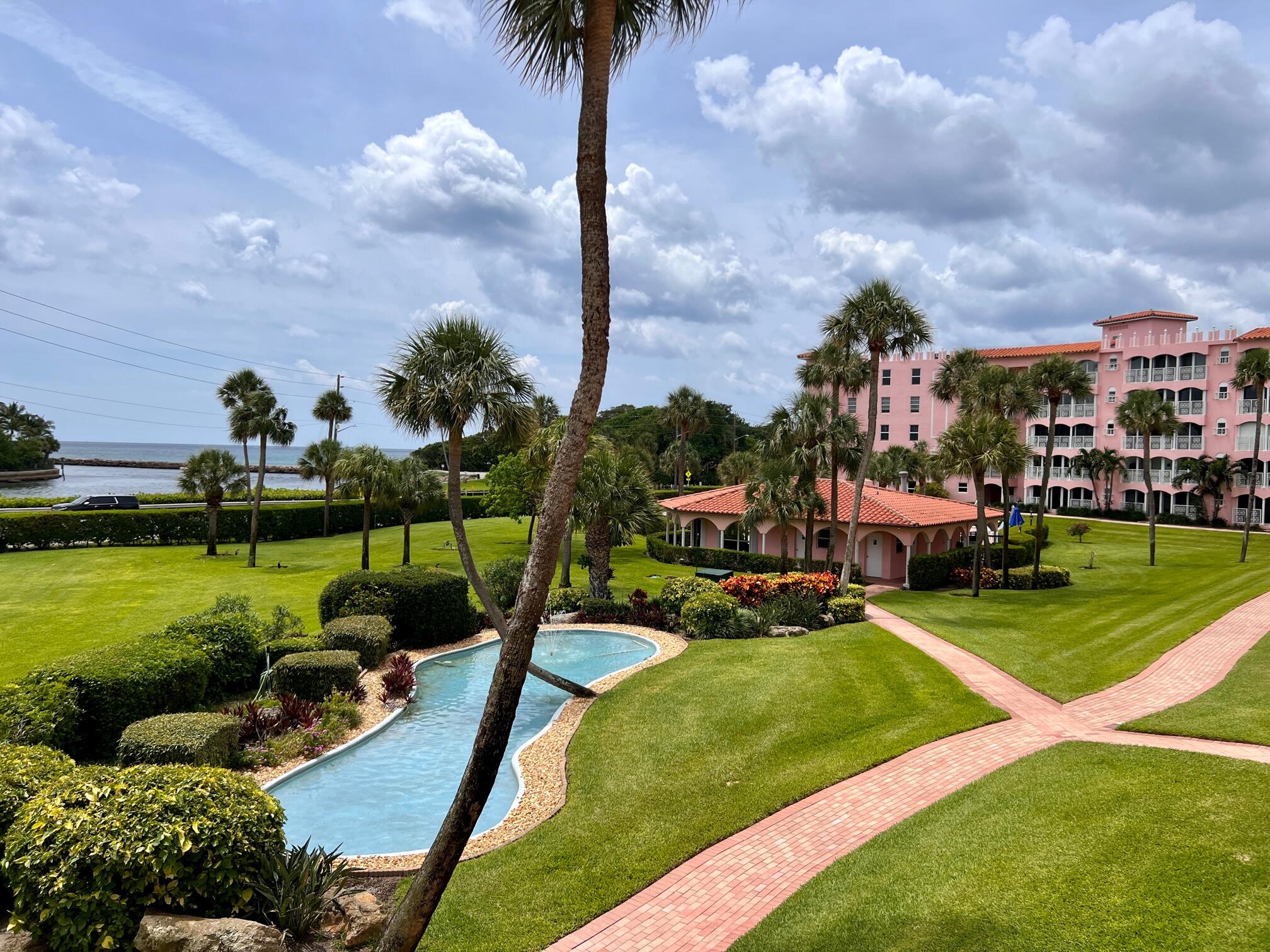 a view of a swimming pool and a yard