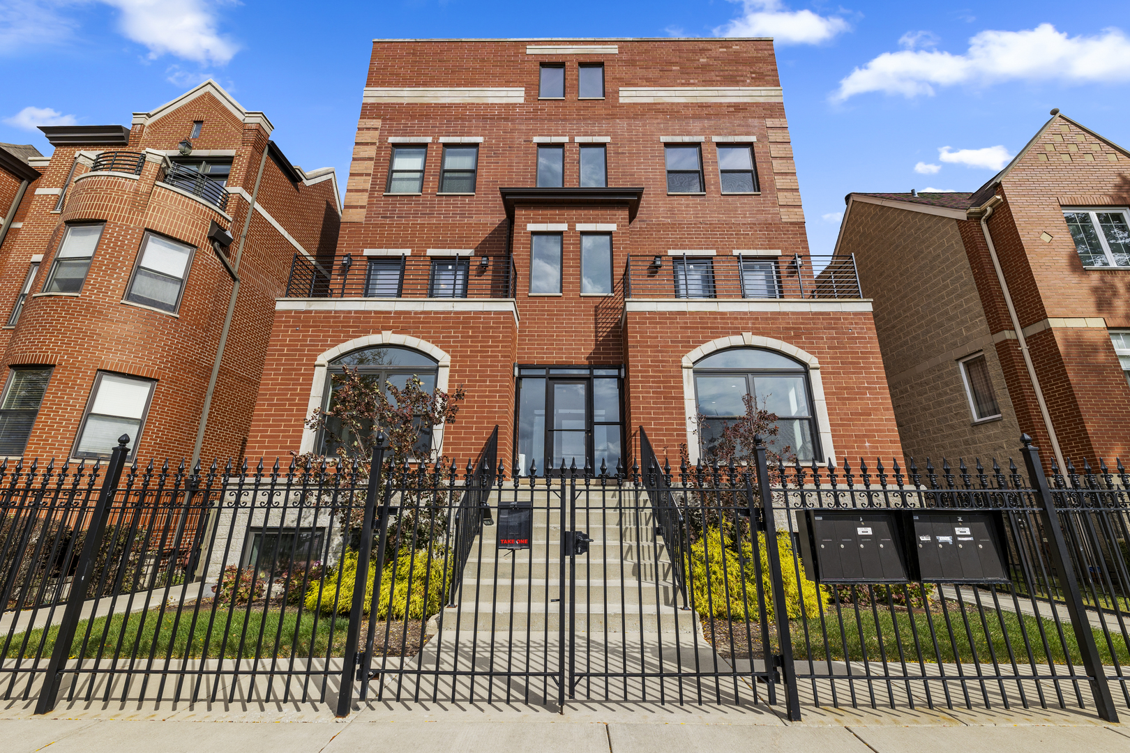 a view of a brick building with many windows