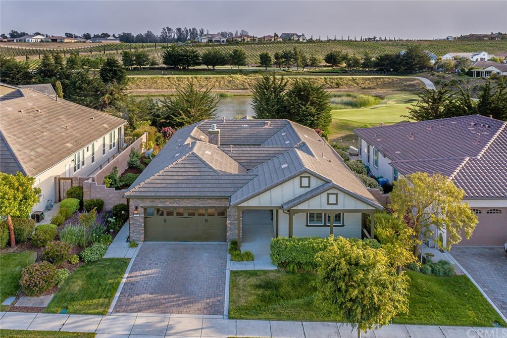 an aerial view of a house with a lake view